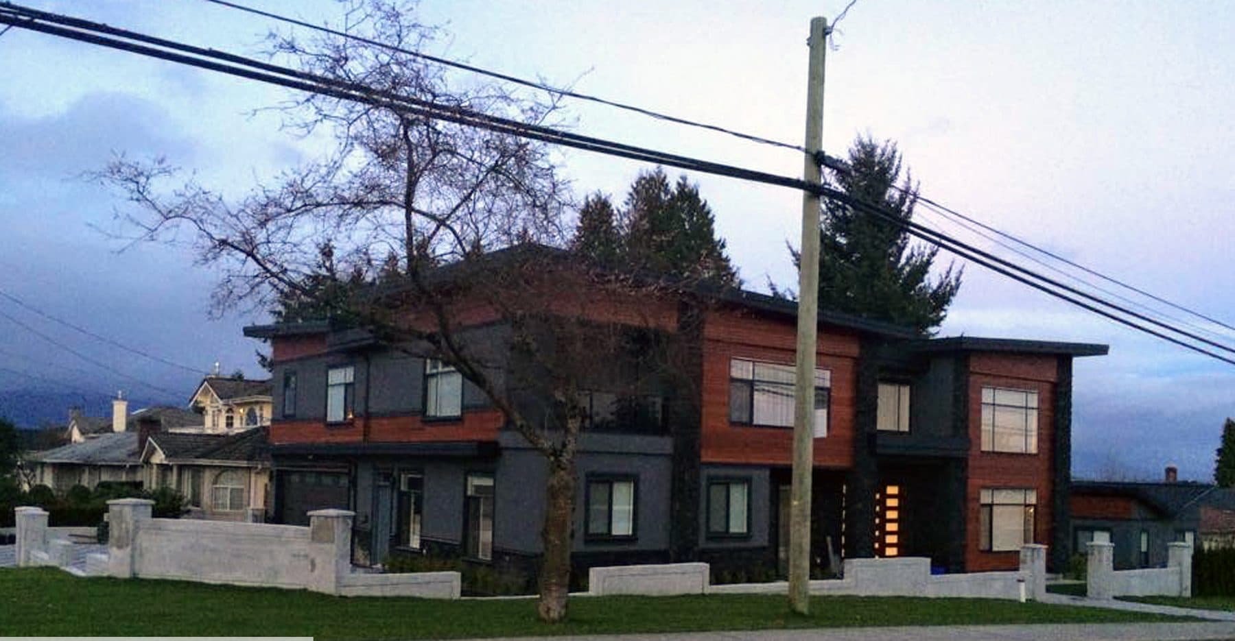 Modern two-storey home with dark cedar and grey stucco cladding